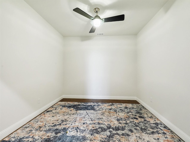 empty room featuring ceiling fan and wood-type flooring