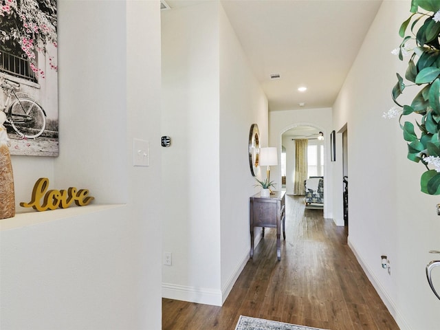 hallway featuring dark wood-type flooring