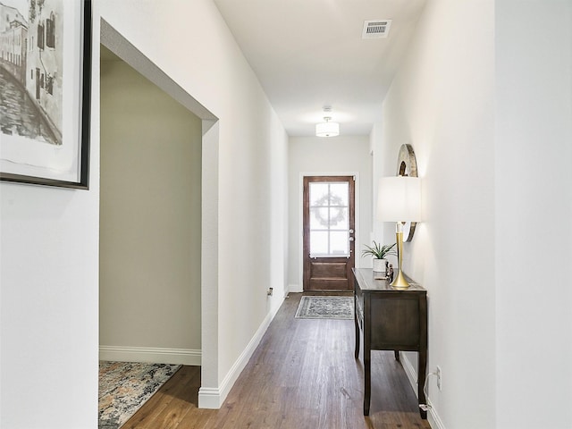 doorway to outside featuring hardwood / wood-style flooring