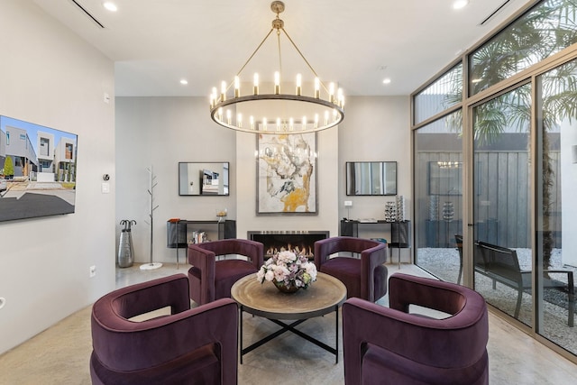 interior space with expansive windows and a chandelier