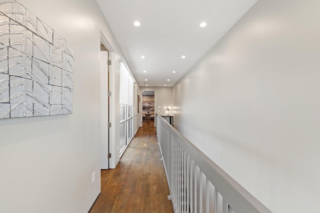 corridor with dark hardwood / wood-style floors