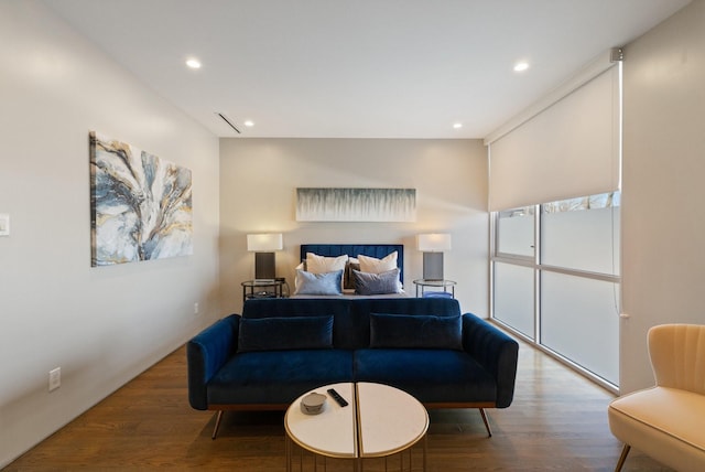 bedroom with hardwood / wood-style floors