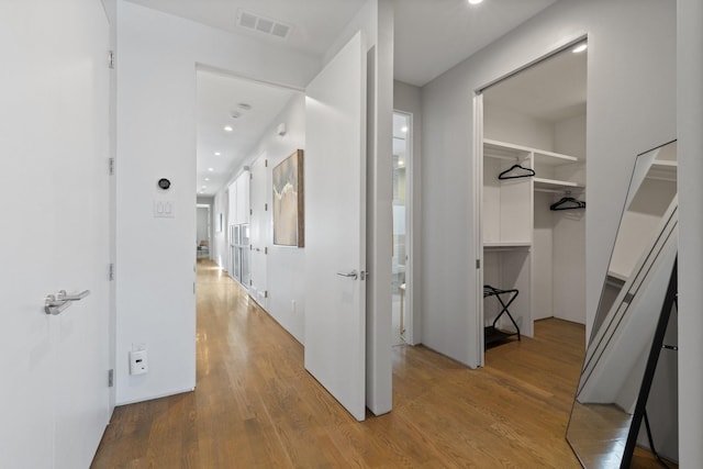 corridor featuring light hardwood / wood-style floors