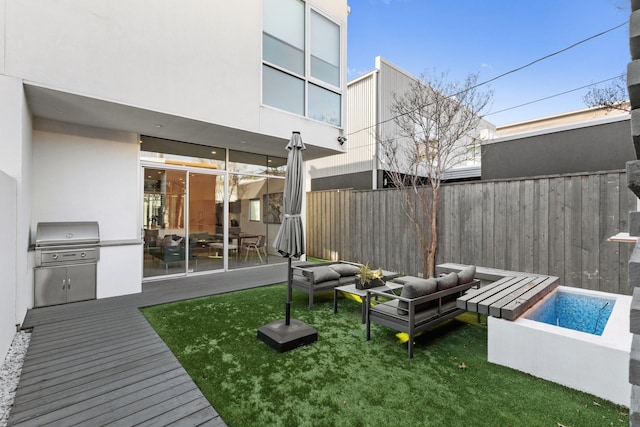 exterior space featuring exterior kitchen and an outdoor hangout area