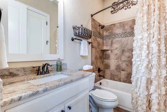 bathroom with shower / tub combo and vanity