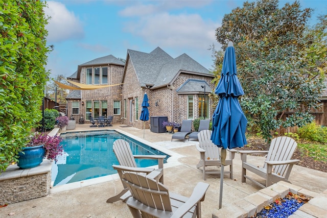 view of swimming pool featuring a patio area