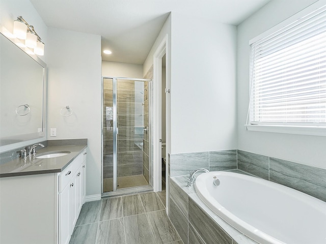 full bathroom with vanity, toilet, a wealth of natural light, and plus walk in shower