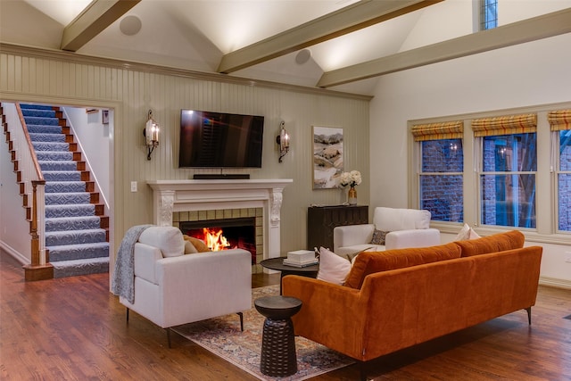 living room featuring a fireplace, dark hardwood / wood-style flooring, and lofted ceiling with beams