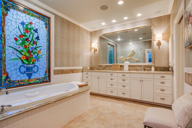 bathroom featuring tiled bath, vanity, ornamental molding, and tile patterned flooring