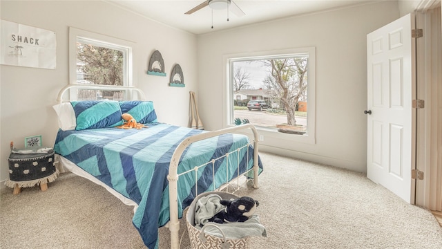 carpeted bedroom featuring ceiling fan