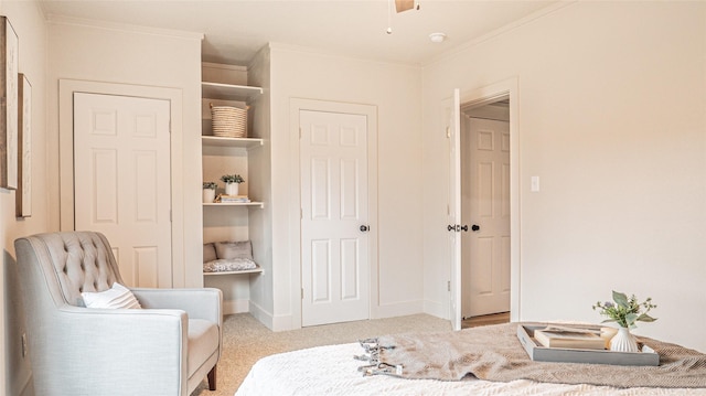 bedroom featuring crown molding and light carpet