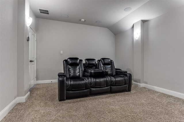 cinema with carpet and lofted ceiling