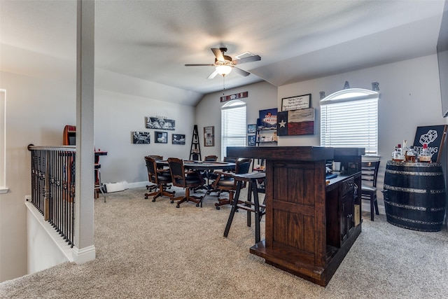 bar featuring ceiling fan, light colored carpet, lofted ceiling, and dark brown cabinets