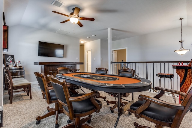 recreation room with vaulted ceiling and carpet