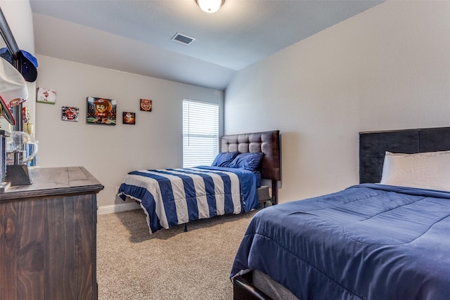 carpeted bedroom featuring vaulted ceiling