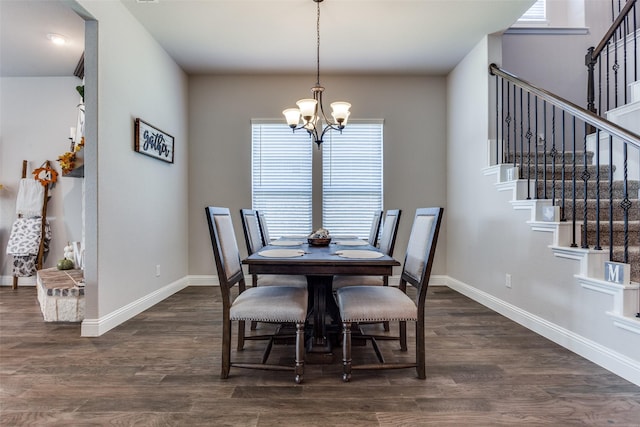 dining area with a chandelier and dark hardwood / wood-style floors