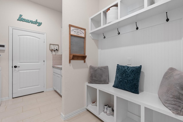 mudroom with light tile patterned flooring