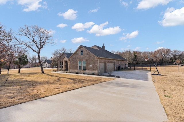 view of front of home with a garage and a front yard