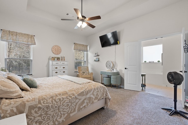 carpeted bedroom featuring ceiling fan