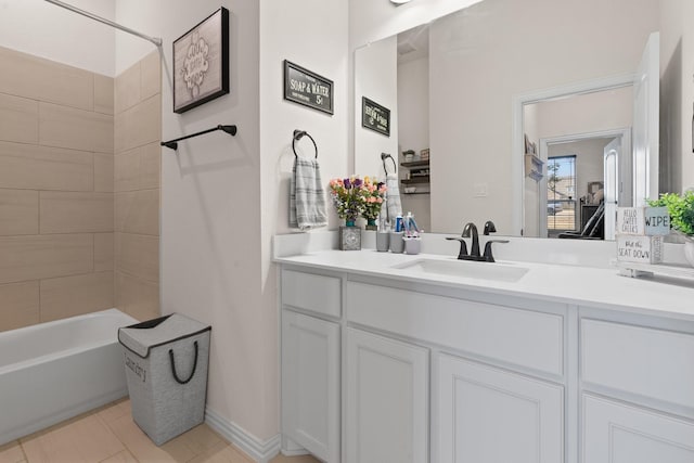 bathroom with vanity and tiled shower / bath combo