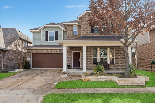 view of front of home with covered porch and a garage