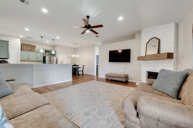 kitchen featuring sink, dishwasher, a kitchen island, and pendant lighting