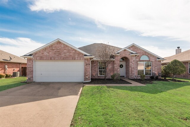 ranch-style home with a garage and a front lawn