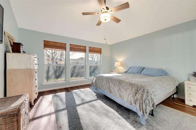 bedroom featuring vaulted ceiling, ceiling fan, and hardwood / wood-style floors