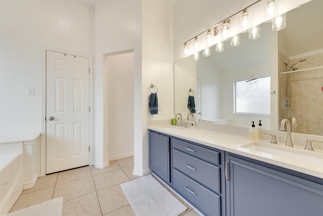 bathroom featuring lofted ceiling, vanity, tile patterned flooring, and a tile shower