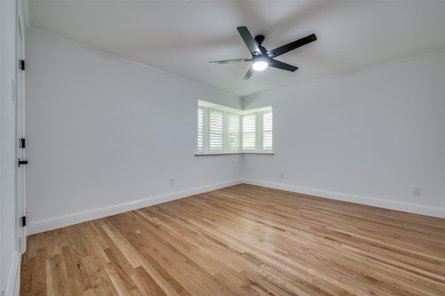 empty room with crown molding, light hardwood / wood-style flooring, and ceiling fan