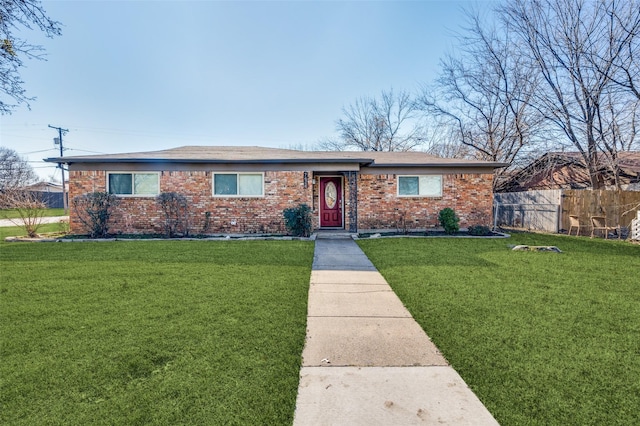 ranch-style home featuring a front yard