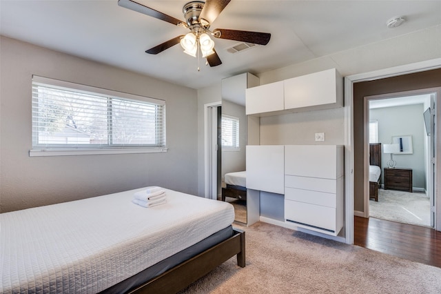 carpeted bedroom with ceiling fan