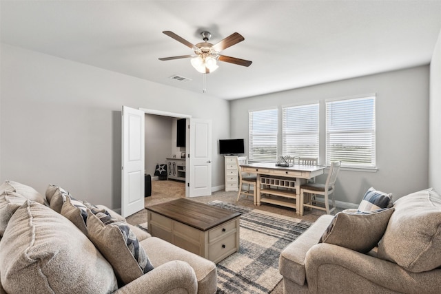 living room with carpet floors and ceiling fan