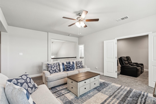 living room featuring ceiling fan and carpet