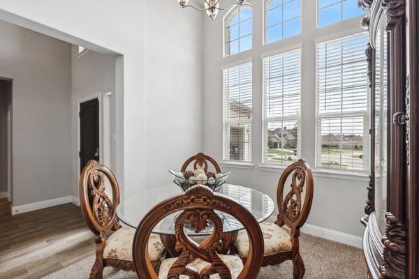 dining area with an inviting chandelier