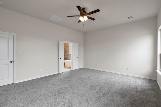 spare room with ceiling fan and carpet flooring