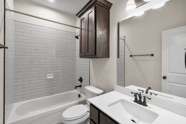 full bathroom with tiled shower / bath combo, vanity, and toilet