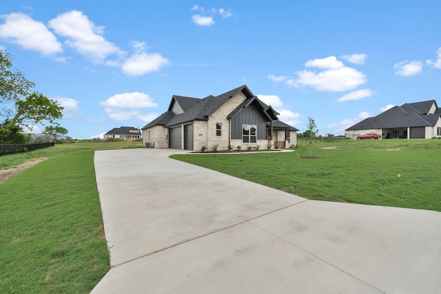 view of front facade featuring a front yard and a garage