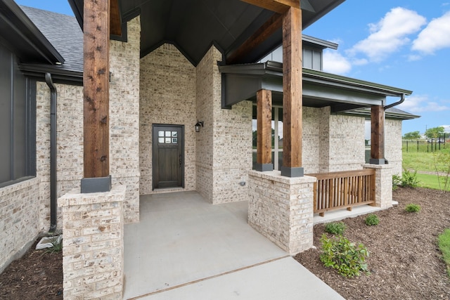 doorway to property with covered porch