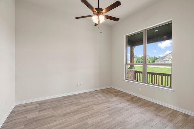 spare room featuring light hardwood / wood-style floors and ceiling fan