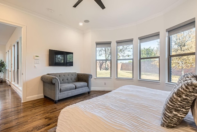 bedroom with ceiling fan, crown molding, and dark hardwood / wood-style floors