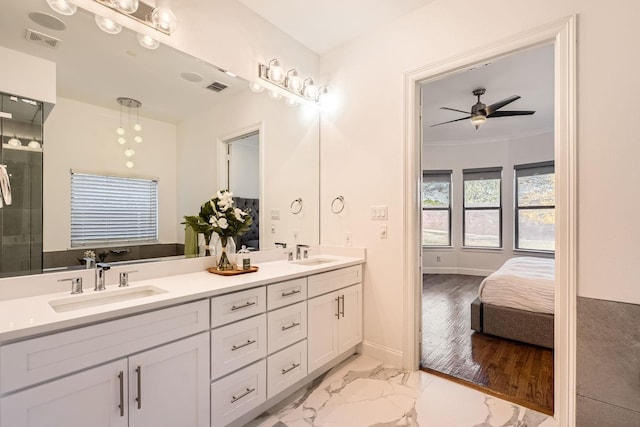 bathroom with vanity, ceiling fan, and ornamental molding