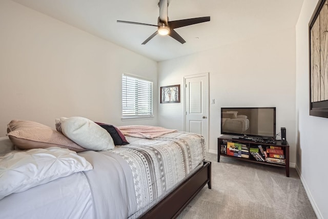 bedroom with ceiling fan and light carpet