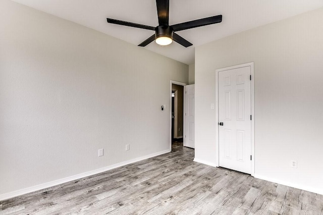 unfurnished bedroom with ceiling fan and light hardwood / wood-style floors