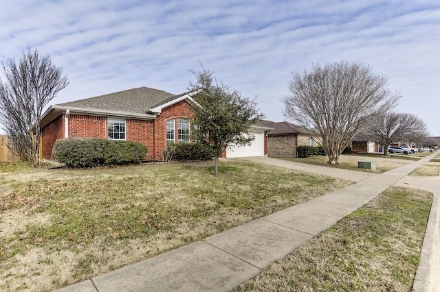 single story home with a garage and a front lawn