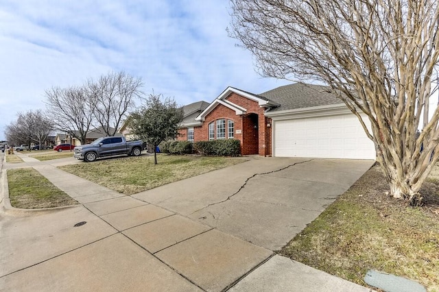 ranch-style home with a garage and a front lawn