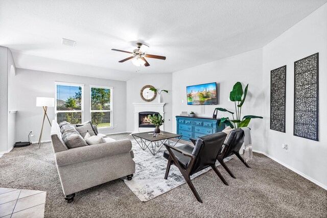 tiled living room featuring ceiling fan