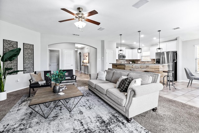 1809 Lake Pine Dr, Little Elm, TX 75068 - living room with a ceiling fan, arched walkways, and baseboards