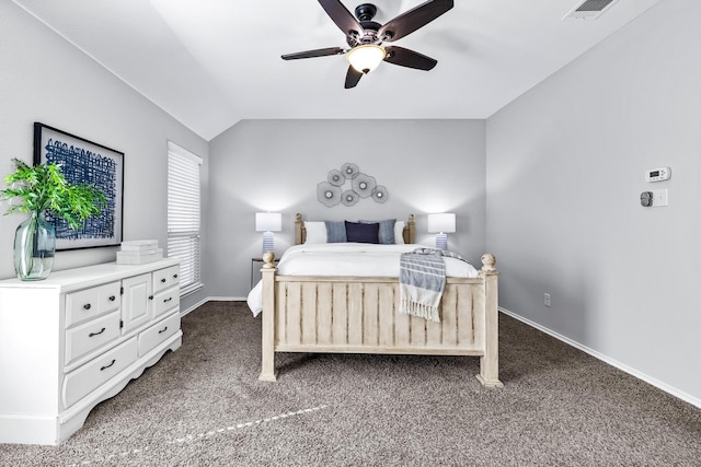 bedroom with a ceiling fan, visible vents, vaulted ceiling, baseboards, and dark colored carpet