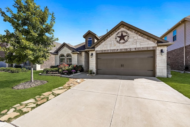 french country home featuring a garage, a front yard, stone siding, and driveway